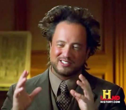 still from History Channel, showing a man with wild hair and a smirk on his face gesturing with his hands. (It was aliens meme)